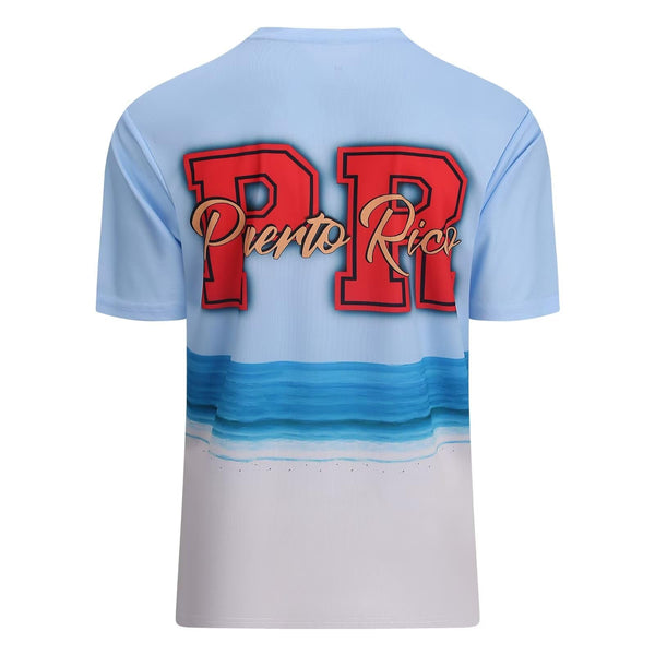 Stylish light blue Puerto Rico t-shirt with bold "PR" and "Puerto Rico" text over a serene beach and ocean wave design, perfect for island pride in 2025