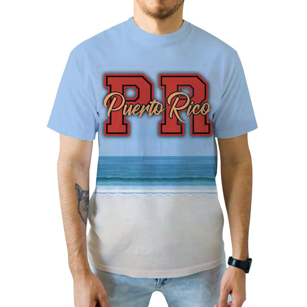 Stylish light blue Puerto Rico t-shirt with bold "PR" and "Puerto Rico" text over a serene beach and ocean wave design, perfect for island pride in 2025.