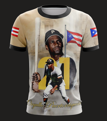A t-shirt featuring an image of a baseball player with the number 21 and the Puerto Rican flag in the background. The shirt has a round neckline and short sleeves.