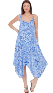 A woman wearing a blue and white geometric patterned knitted maxi dress with a V-neck and sleeveless design.