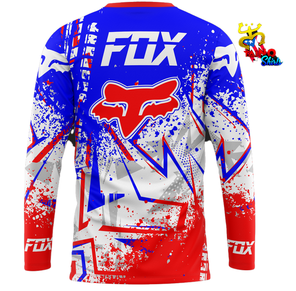 Fox racing t-shirt featuring a bold blue, red, and white design with the iconic Fox logo and splatter effects, perfect for motorsport enthusiasts in 2025, designed by Taino Shirts.5.9sFast