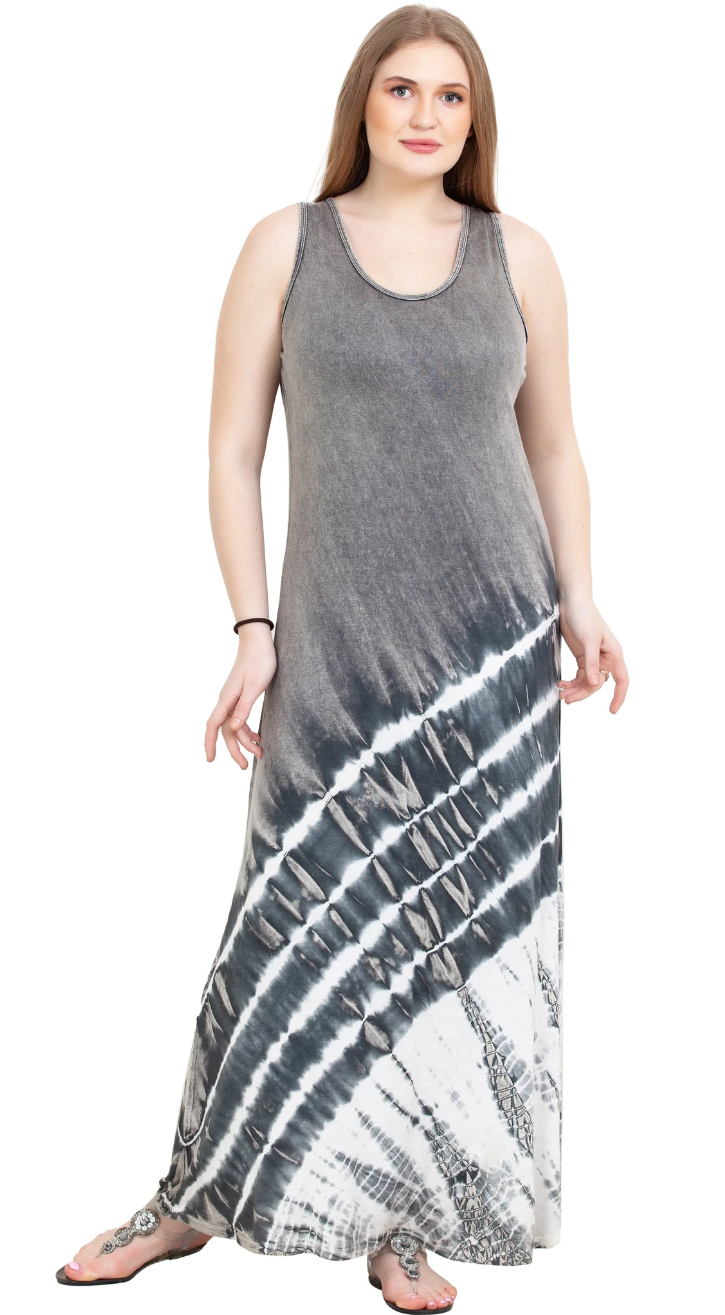 A model wearing a sleeveless maxi dress with tie-dye pattern predominantly in gray and white colors.
