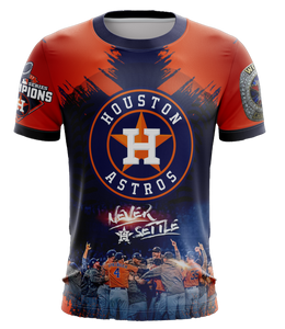 A vibrant orange and navy blue Houston Astros fan shirt featuring the team logo, "Never Settle" text, a World Champions patch from 2017, and an image of celebrating players, set against a black background.