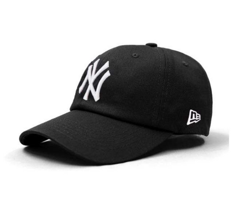 A black snapback baseball hat with the NY Yankees logo embroidered on the front.