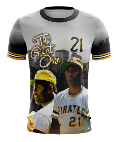 A t-shirt featuring a graphic design with the text 'The Great One 21', depicting a baseball player in a Pirates uniform, in reference to Roberto Clemente.