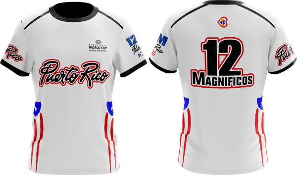 A white round neck t-shirt with short sleeves featuring red and blue accents and text that reads '12 Magníficos'. There is also text 'Puerto Rico' and 'Taino Shirts' on the shirt.