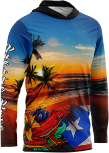 A hoodie featuring a colorful graphic design with a sunrise, palm trees, and the image of a coqui taino on the front.