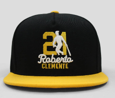 Black and yellow baseball cap featuring Roberto Clemente with number 21 and silhouette, perfect for Pittsburgh Pirates fans and baseball memorabilia collectors.