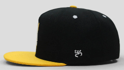 Black and yellow baseball cap featuring Roberto Clemente with number 21 and silhouette, perfect for Pittsburgh Pirates fans and baseball memorabilia collectors.