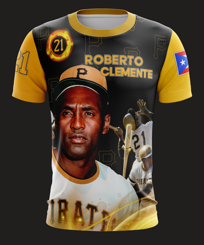 A short-sleeved t-shirt featuring a graphic print of Roberto Clemente in a baseball uniform with the number 21, along with the text 'ROBERTO CLEMENTE' and the logo of a sports team.