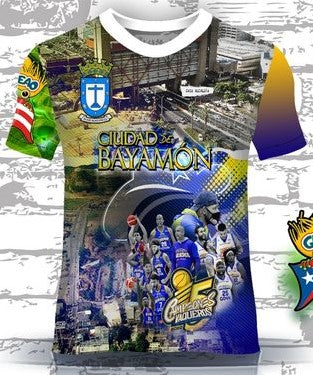 A vibrant t-shirt celebrating Bayamón, Puerto Rico, with front and back designs. The front features "Ciudad Bayamón" with images of basketball players, a cityscape, and the "Gigantes de Carolina" logo, complemented by a Gufeao emblem with the Puerto Rican flag. The back showcases a chicharrón food cart, a Ferris wheel, and the "Parque de las Ciencias" with a colorful sky, ideal for showcasing Bayamón pride and Puerto Rican culture.