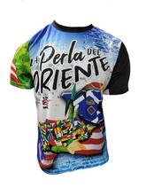 A vibrant t-shirt celebrating Humacao, Puerto Rico as "La Perla del Oriente" with front and back designs. The front features bold text "La Perla del Oriente" with a colorful flag collage, a coat of arms, and a blue gradient background with the Puerto Rican flag. The back showcases a rural landscape with cows, a "Humacao Isla del Encanto" sign, and a large star with a Gufeao logo, perfect for expressing Humacao pride and Puerto Rican heritage.