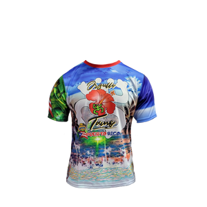 A colorful t-shirt celebrating "Orgullo Coquí Luquillo Puerto Rico" with a vibrant tropical design featuring a large red hibiscus flower, palm trees, a beach and ocean scene, Puerto Rican flag elements, and green accents, ideal for showing Puerto Rican pride and love for Luquillo's coastal vibes.