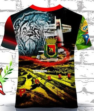 A vibrant t-shirt celebrating Ponce, Puerto Rico, with front and back designs. The front features a colorful Vejigante character in traditional red and black stripes, set against a backdrop of historic Ponce architecture and the "Bombas de Ponce" sign. The back showcases a tiger graphic, a lighthouse, and a yellow road with the Puerto Rican flag emblem, ideal for showcasing Ponce pride and Puerto Rican culture.