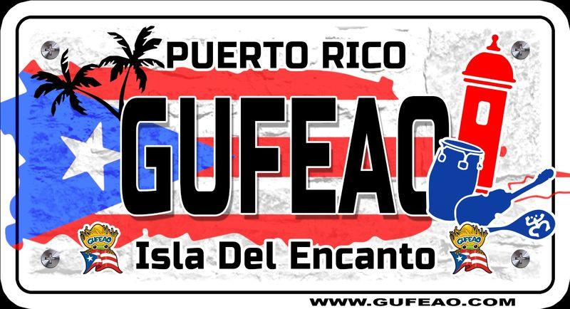 A stylized license plate with a distressed background featuring the Puerto Rican flag's blue triangle with white star and red stripes. The word "GUFEAO" is prominently displayed in large black letters, with "PUERTO RICO" above in red. Icons include palm trees, a red sentry box, a blue conga drum, and a guitar. Below, "Isla Del Encanto" is written in black, flanked by two "Gufeo" cartoon characters with flags. The website "www.gufeo.com" is at the bottom.