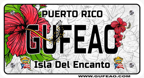 A stylized license plate with a background featuring the Puerto Rican flag's red and white stripes and blue triangle with a white star, adorned with hibiscus flowers and green leaves. The word "GUFEAO" is prominently displayed in large black letters, with "PUERTO RICO" above in black. Below, "Isla Del Encanto" is written in black, flanked by two "Gufeo" cartoon characters with flags. The website "www.gufeo.com" is at the bottom.
