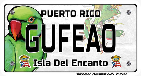 A stylized license plate with a background of the Puerto Rican flag's red and white stripes and blue triangle with a white star, featuring a large green parrot on the left and smaller parrots flying on the right. The word "GUFEAO" is prominently displayed in large black letters, with "PUERTO RICO" above in black. Below, "Isla Del Encanto" is written in black, flanked by two "Gufeo" cartoon characters with flags. The website "www.gufeo.com" is at the bottom.