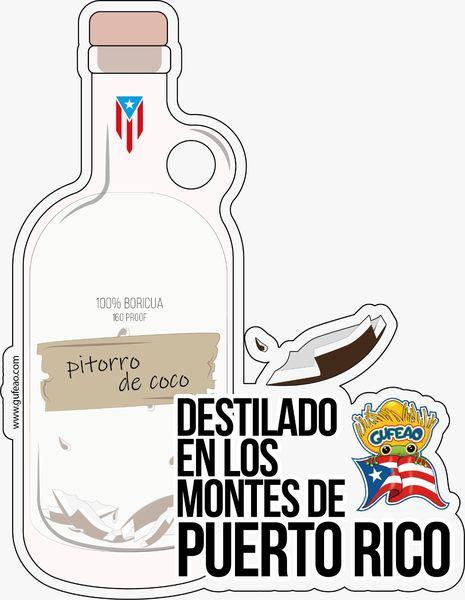 An illustration of a bottle labeled "Pitorro de Coco," featuring a clear design with a Puerto Rican flag on the neck. The label includes "100% Boricua" and a torn effect, with text "Destilado en los Montes de Puerto Rico" in bold. A coconut slice and the "Gufeo" cartoon character with a flag are depicted on the side. The website "www.gufeo.com" is noted at the top.
