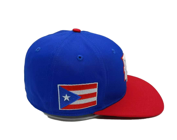 Puerto Rico PR baseball cap featuring a vibrant blue crown with a red bill, bold "PR" lettering in white with red outline, and a small Puerto Rican flag on the side, perfect for sports fans in 2025.
