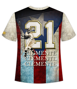 A stylish t-shirt featuring front and back designs honoring Roberto Clemente, a legendary baseball player. The front showcases Clemente in his batting pose against a stadium backdrop with a Puerto Rican flag, while the back displays his number 21 and name in bold, set against a distressed flag design.