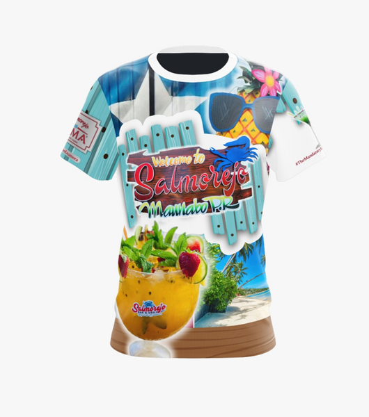 A vibrant t-shirt featuring the "Welcome to Salmorejo Miamarina" design, showcasing a tropical theme with a large Salmorejo cocktail garnished with fruit, palm trees, and a beach scene. The design includes a wooden sign, a blue star, sunglasses, a crab, and the #TheMandator75 hashtag, ideal for fans of Caribbean-inspired fashion and Miamarina culture.