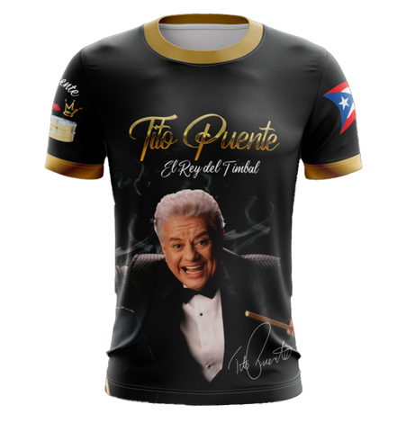A black T-shirt featuring an image of Tito Puente with text 'Tito Puente El Rey del Timbal' and the flag of Puerto Rico.